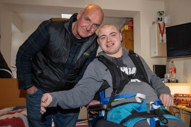 Charlie Stapleford, 20, at home with Grandad Mark Westrope after having his place at St Vincent College revoked following the council being unable to provide transport. Picture: Alex Shute