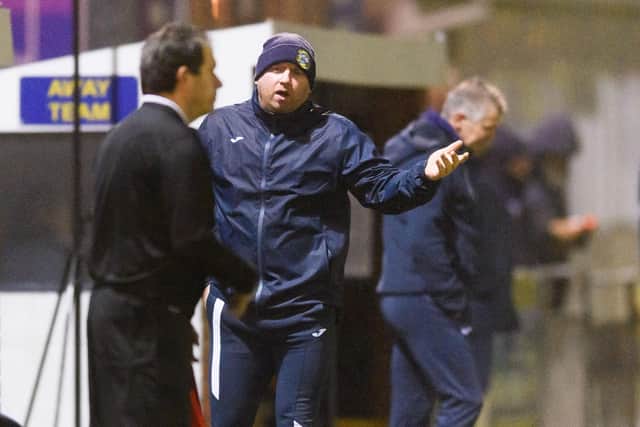 A Gosport Borough backroom staff member has a word with the linesman.
Picture: Keith Woodland