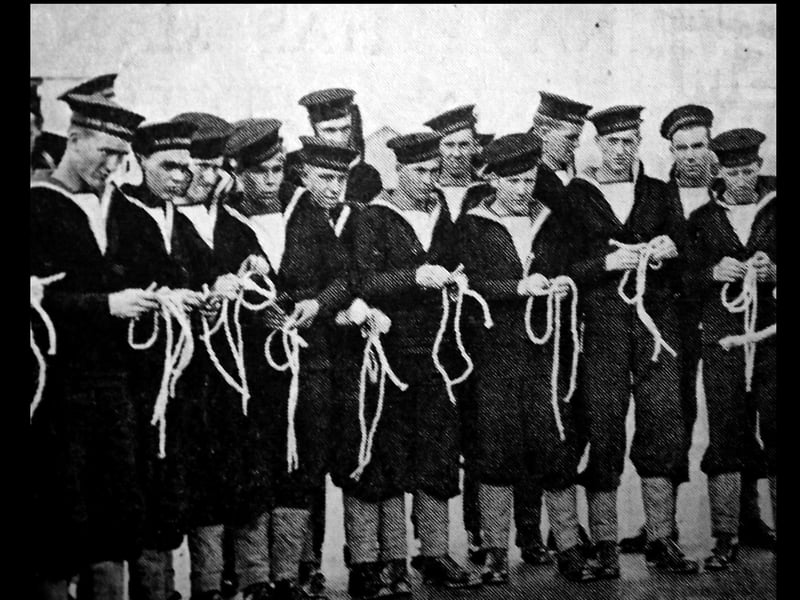 New entrants into the navy are being taught how to tie knots at HMS Collingwood, Fareham in November 1940.