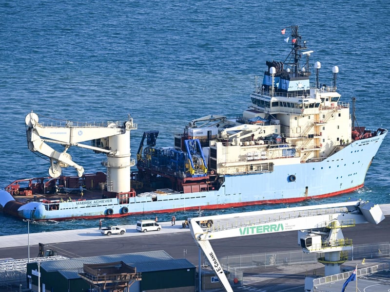 The recovered tail section of the Merlin Mk4 helicopter is bought into Portland Port, on September 18, 2024 in Portland, England. A Merlin Mk4 helicopter ditched into the sea close to HMS Queen Elizabeth while conducting night training off the Dorset coast on September 5. The pilot, Lt Rhodri Leyshon, was killed and two of the three crew from the 846 Naval Air Squadron aircraft were rescued.