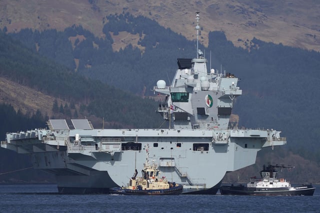 The Royal Navy aircraft carrier HMS Queen Elizabeth leaving Glen Mallan in Loch Long with the Arrochar Alps behind. Picture: Andrew Milligan/PA Wire