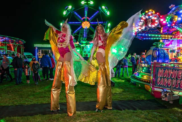 Stilt walkers from Ethereal Performance touring the site. Picture: Mike Cooter (281021)