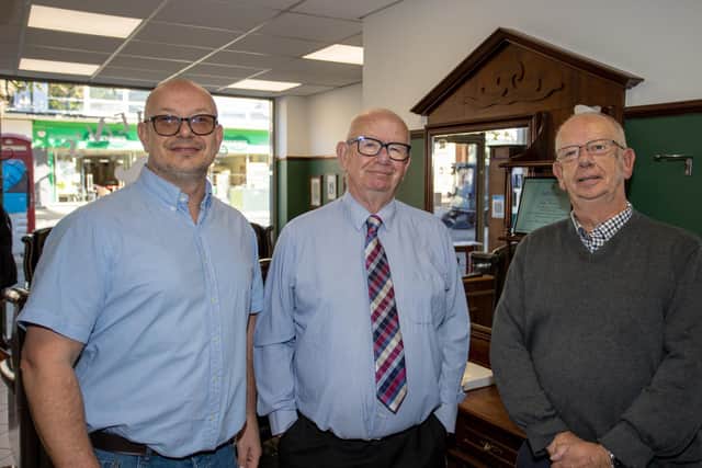 Steve Haines of Stephen's Barbers celebrating 100 years of business with his brother Roger (right) and son Sean (left). Photo by Alex Shute