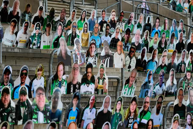 Fan cardboard cutouts with portraits of Borussia Moenchegladbach's supporters at their Borussia Par. Picture:  INA FASSBENDER/AFP via Getty Images