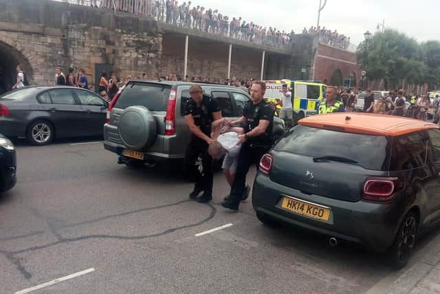 Youths at the Hotwalls in Old Portsmouth on July 25 in 2019 at around 4.40pm as police are seen making an arrests.