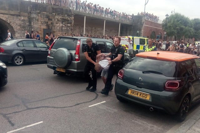 Youths at the Hotwalls in Old Portsmouth on July 25 in 2019 at around 4.40pm as police are seen making an arrests.