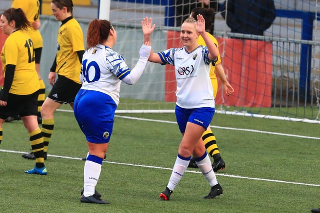 Hawks' Jodie Burchell scores her sixth goal and celebrates with Chloe Dark. Picture by Dave Haines