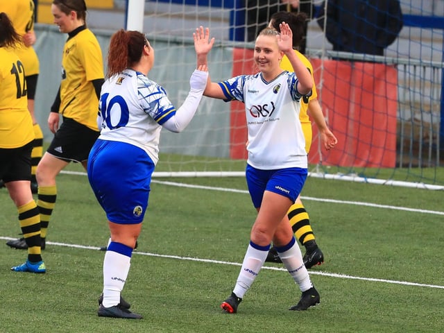 Hawks' Jodie Burchell scores her sixth goal and celebrates with Chloe Dark. Picture by Dave Haines