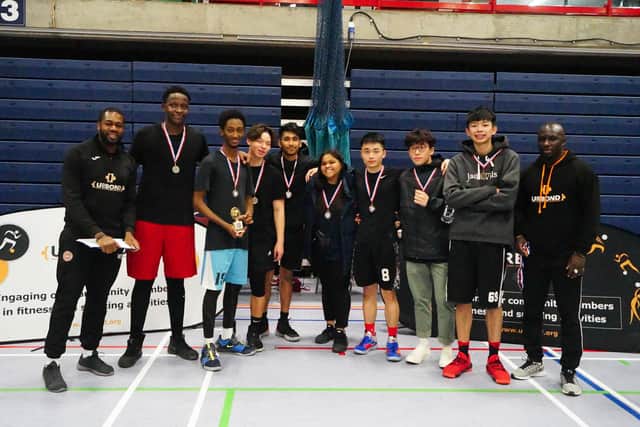 Runners-up Hot Shots - Jenson Soh, Jerry Wu, Moussa Mouctar, Kudzanayi Lionel, Ming Ming and MD Nas - with organisers Hans and Drame from URBOND