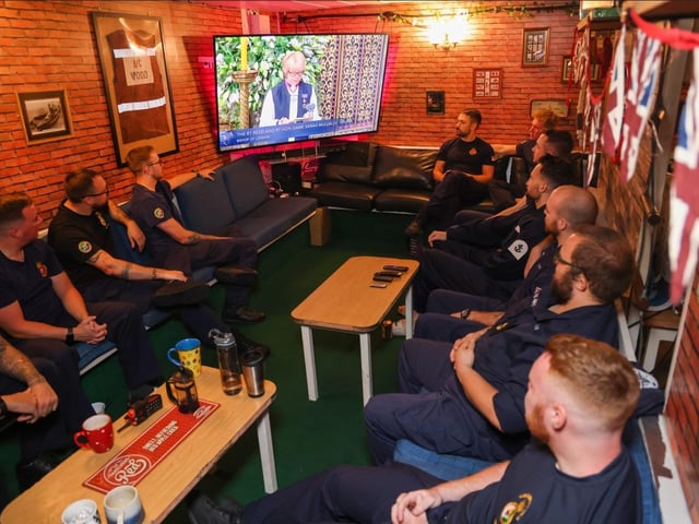 HMS Queen Elizabeth's Ship's Company watches HM Queen Elizabeth II funeral live in their Mess decks while deployed in September 2022 while crossing the Atlantic Ocean. Due to the time difference, ship's company got up early to watch it as they were in North America.