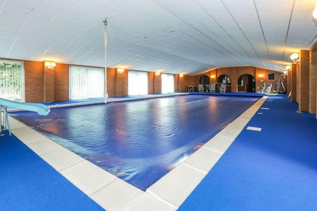 As well as this great pool, this four-bedroom detached also has a snooker room, squash court and tennis court. Price: £800,000