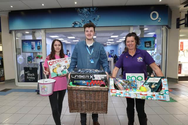 Tilly Hadley and Pam Marshall from Hannah's Appeal pictured with O2 store manager Joel Hatchard. Picture: Stuart Martin (220421-7042)