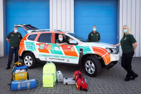 Fareham first responders, from left, Andrew Robinson, Rob Barlett, Derek Meek and Tracy Gregory with their newly donated vehicle. Pictured in Segensworth with some of the equipment they carry in the foreground
Picture: Chris Moorhouse