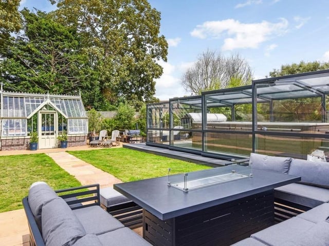 The garden is spacious and has a swimming pool that is enclosed.