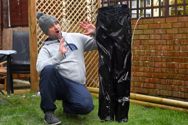 Marcin, 38, a radiography department assistant at the Queen Alexandra hospital in Portsmuth, sprayed water over the trousers every 10 minutes for more than an hour to ensure they'd freeze. Picture: Roger Arbon/Solent News & Photo Agency