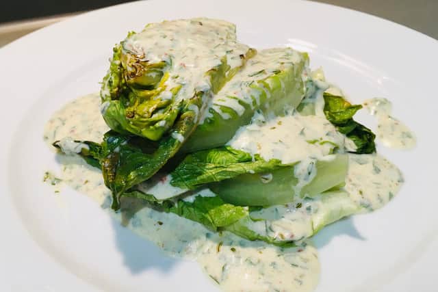 Lawrence’s dish of charred baby gem salad.