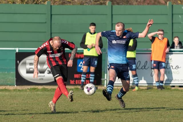 Fareham Town's Ash Tattersall and AFC Portchester defender Harry Birmingham, right, in 2018/19. Picture: Vernon Nash