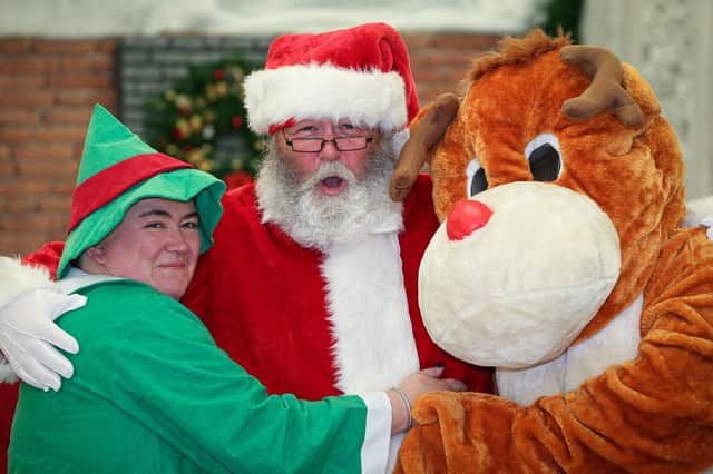 Virtual Father Christmas with one of his elves and a reindeer, Greywell Shopping Centre, Leigh Park. Picture: Chris Moorhouse      (121220-13)