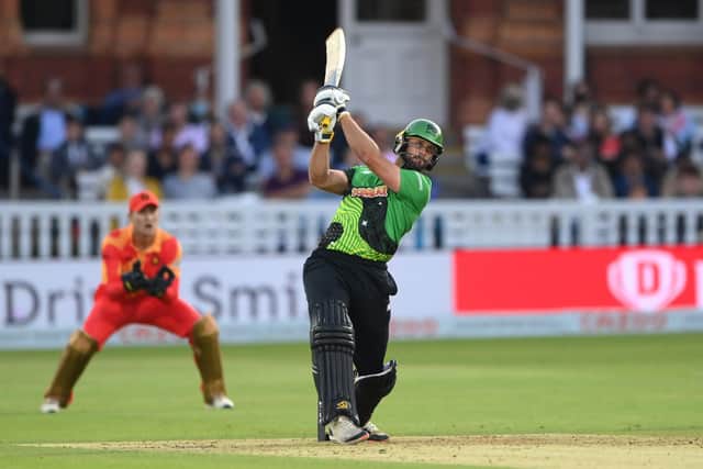 Brave batsman Ross Whiteley hits out watched by Phoenix keeper Chris Benjamin. Photo by Stu Forster/Getty Images.