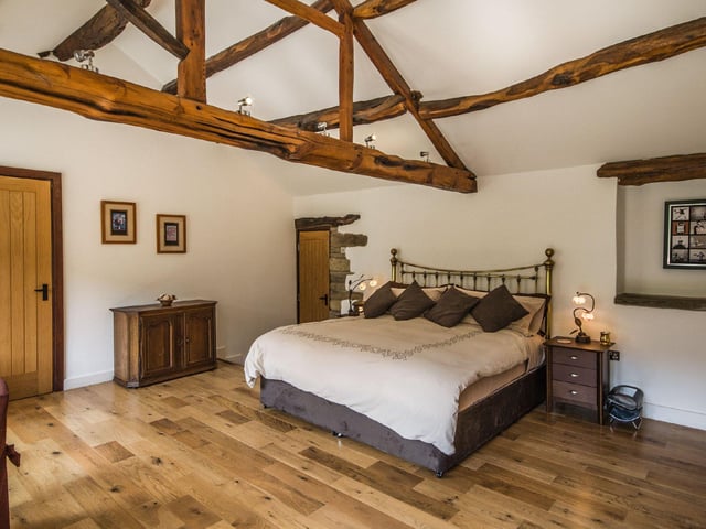 The property boasts five well presented bedrooms in total, with the large master on the ground floor featuring its own en-suite and bi-folding doors to look out onto the sprawling grounds.