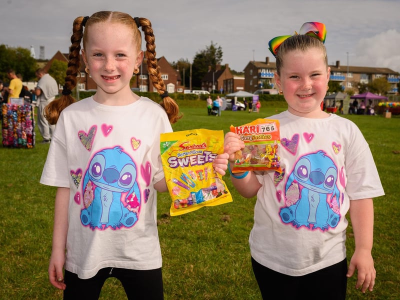 Pictured is: Polly and Pearl Hedges with the prizes they won at the tombola
Picture: Keith Woodland (300921-30)