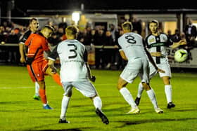 Jake Raine fires Portchester's stoppage time winner against Bemerton last October. They need to complete the double on Tuesday to stand any chance of winning the Wessex League title. Picture by Daniel Haswelll