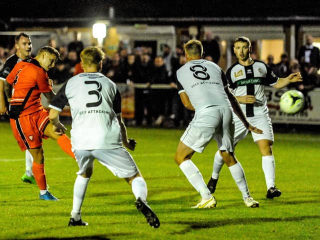 Jake Raine fires Portchester's stoppage time winner against Bemerton last October. They need to complete the double on Tuesday to stand any chance of winning the Wessex League title. Picture by Daniel Haswelll