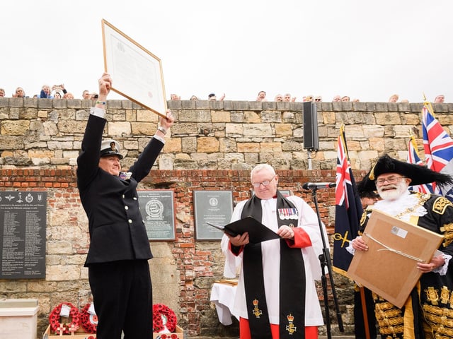 Pictured is: CPO Alan Ward with the Freedom of Portsmouth Citation to all Falkland Veterans. Picture: Keith Woodland (190621-262).