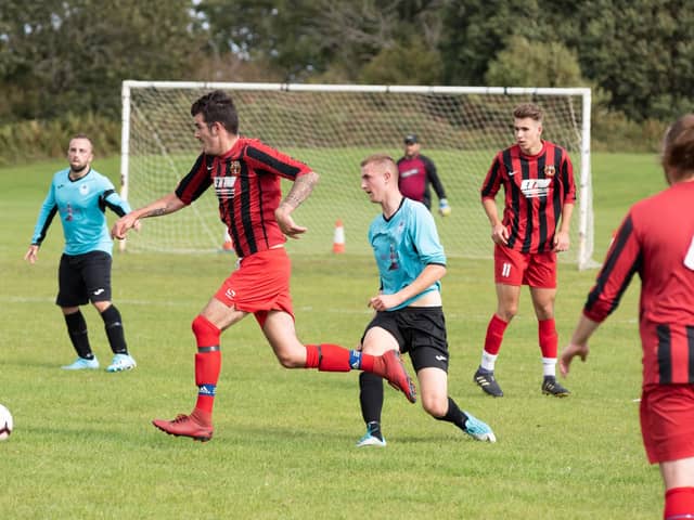 Horndean (red/black) in Mid-Solent League action against Burrfields in the 2019/20 season. Picture: Duncan Shepherd
