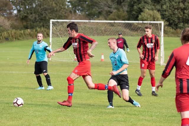 Horndean (red/black) in Mid-Solent League action against Burrfields in the 2019/20 season. Picture: Duncan Shepherd