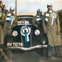 Sent in by Brian Sessions of Bedhampton, here we see a marvellous tinted photo from 1939. It was taken at 33, Madeira Road, Copnor just before the party set off for Wembley for the 1939 cup final. On the left is Stan Davis Brian's uncle. Next to him is George Sessions, Brian's father and third from the left is his grandfather George Sessions. The man far right is a neighbour.
The car was a Ford 8 or 10 no doubt the 'latest in motoring' in those days.