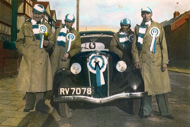 Sent in by Brian Sessions of Bedhampton, here we see a marvellous tinted photo from 1939. It was taken at 33, Madeira Road, Copnor just before the party set off for Wembley for the 1939 cup final. On the left is Stan Davis Brian's uncle. Next to him is George Sessions, Brian's father and third from the left is his grandfather George Sessions. The man far right is a neighbour.
The car was a Ford 8 or 10 no doubt the 'latest in motoring' in those days.