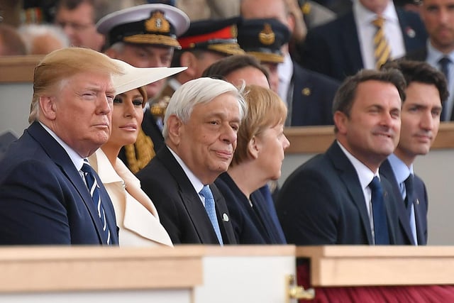 US President Donald Trump (L), US First Lady Melania Trump (2L), Greek President Prokopis Pavlopoulos (3L), German Chancellor Angela Merkel (C), Luxembourg's Prime Minister Xavier Bettel (2R) and Canadian PM Justin Trudeau