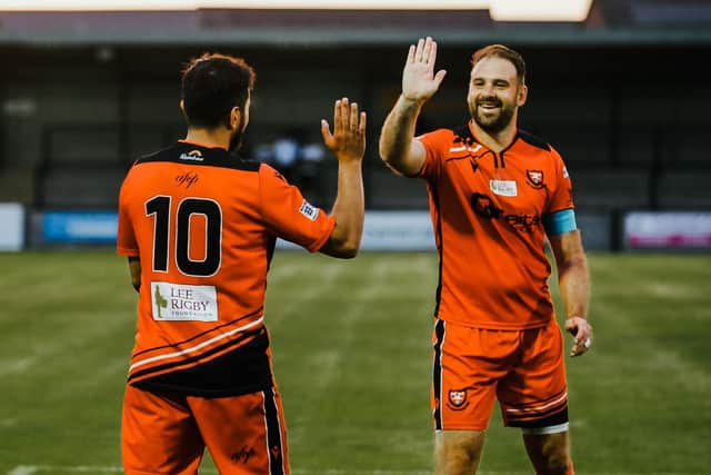 Brett Pitman, right, headed a late winner for AFC Portchester at Baffins. Picture by Daniel Haswell