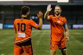 Brett Pitman, right, headed a late winner for AFC Portchester at Baffins. Picture by Daniel Haswell