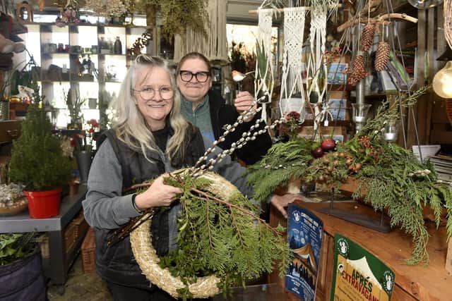 Karla Bell, left, owner of Blooms & Balloons in Copnor Road, Portsmouth, with helper Sam Howell. Picture: Sarah Standing (281124-6711)