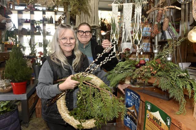Karla Bell, left, owner of Blooms & Balloons in Copnor Road, Portsmouth, with helper Sam Howell. Picture: Sarah Standing (281124-6711)