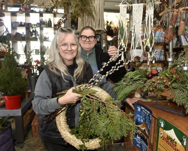 Karla Bell, left, owner of Blooms & Balloons in Copnor Road, Portsmouth, with helper Sam Howell. Picture: Sarah Standing (281124-6711)