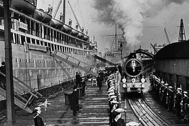 The royal train departing from the dockyard railway jetty in December 1910. This rail link was established from Portsmouth Harbour station in 1879.