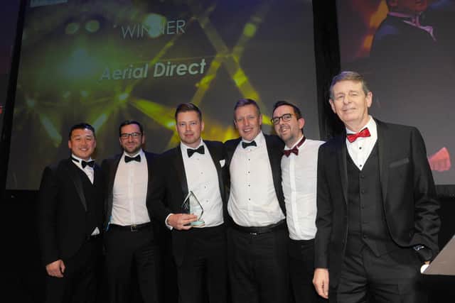 Pictured is: (right) Bill Moulsdale from sponsor Giant Leap Video & Photography with winners of the Large Business of the Year 2020 Award Aerial Direct.
Picture: Sarah Standing (210220-8429)