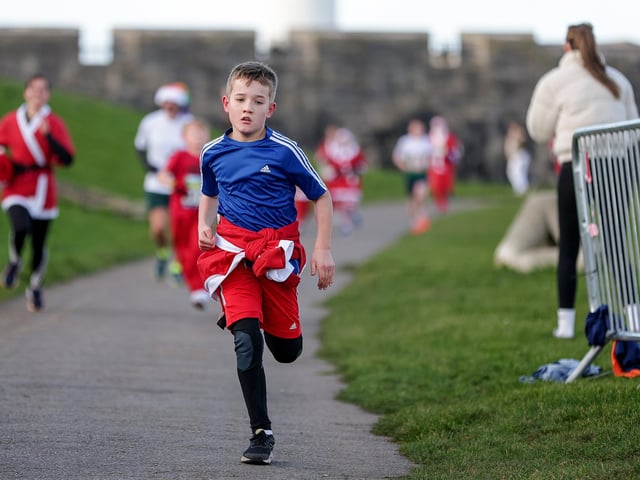 A number of runners took to the picturesque coastal route to take on the Portsmouth Coastal Waterside Marathon, Festive Half Marathon, as well as the Southsea 5k and 10k Turkey Trot. Picture: Chris  Moorhouse (221224-73)