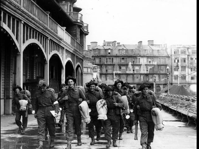 Embarking for D-Day South Parade Pier, Southsea. Some smiling others in deep thought. Soldiers walk along South Parade Pier to embark for Normandy. (c) The News, War Series 2859