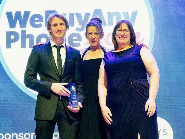 Yvonne Clay, centre director at Gunwharf Quays, presented the Medium Business of the Year award to Charlie Bicholas and Maddie Gunnie of WeBuyAnyPhone.com.  Picture: Keith Woodland (270321-246)