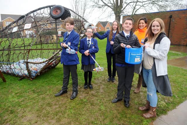 Students from Cams Hill School in Fareham, are working with the Gosport and Fareham Wombles as part of a litter campaign.

Pictured is: (l-r) Kyle Robinson (13), Megan Beresford (11), Jessica Davies (14) and Cole McIntosh (12) with assistant headteacher Tanya Noble and Steph Suter from Gosport and Fareham Wombles.

Picture: Sarah Standing (050320-9552)