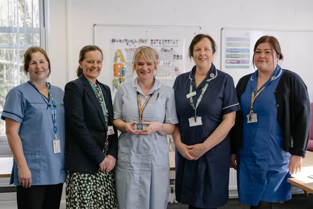 Charmaine Watts has been awarded the Chief Nursing Officer Award. 
Pictured: Charmaine (middle) with her colleagues.