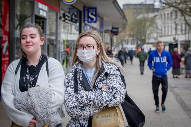 People are wearing surgical masks to protect themselves against Coronavirus in Commercial Road, Portsmouth. Pictured: Ruby Hughes and Julita Baluta.
Picture: Habibur Rahman