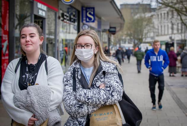 People are wearing surgical masks to protect themselves against Coronavirus in Commercial Road, Portsmouth. Pictured: Ruby Hughes and Julita Baluta. 
Picture: Habibur Rahman