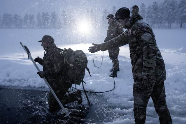 Pictured are Commando Forces conducting Ice Breaking drills during their Cold Weather Survival Course (CWSC) near Skjold.