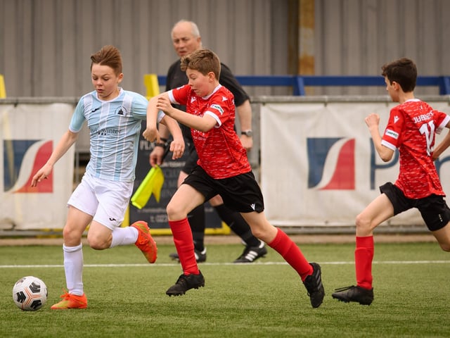 Action from the Portsmouth Youth League Geldard Invitation Cup final between Jubilee 77 U13s and Castle United U13s (light blue and white kit). Picture: Keith Woodland (190321-537)