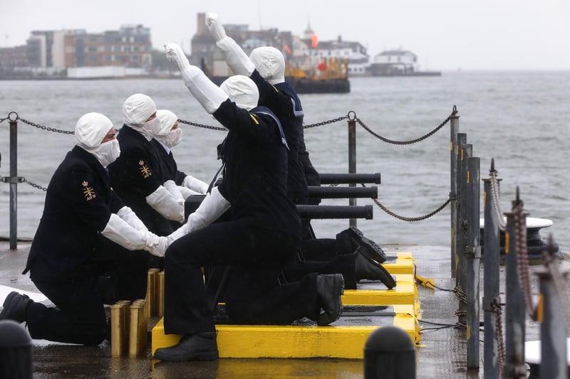Sailors readying themselves to fire.